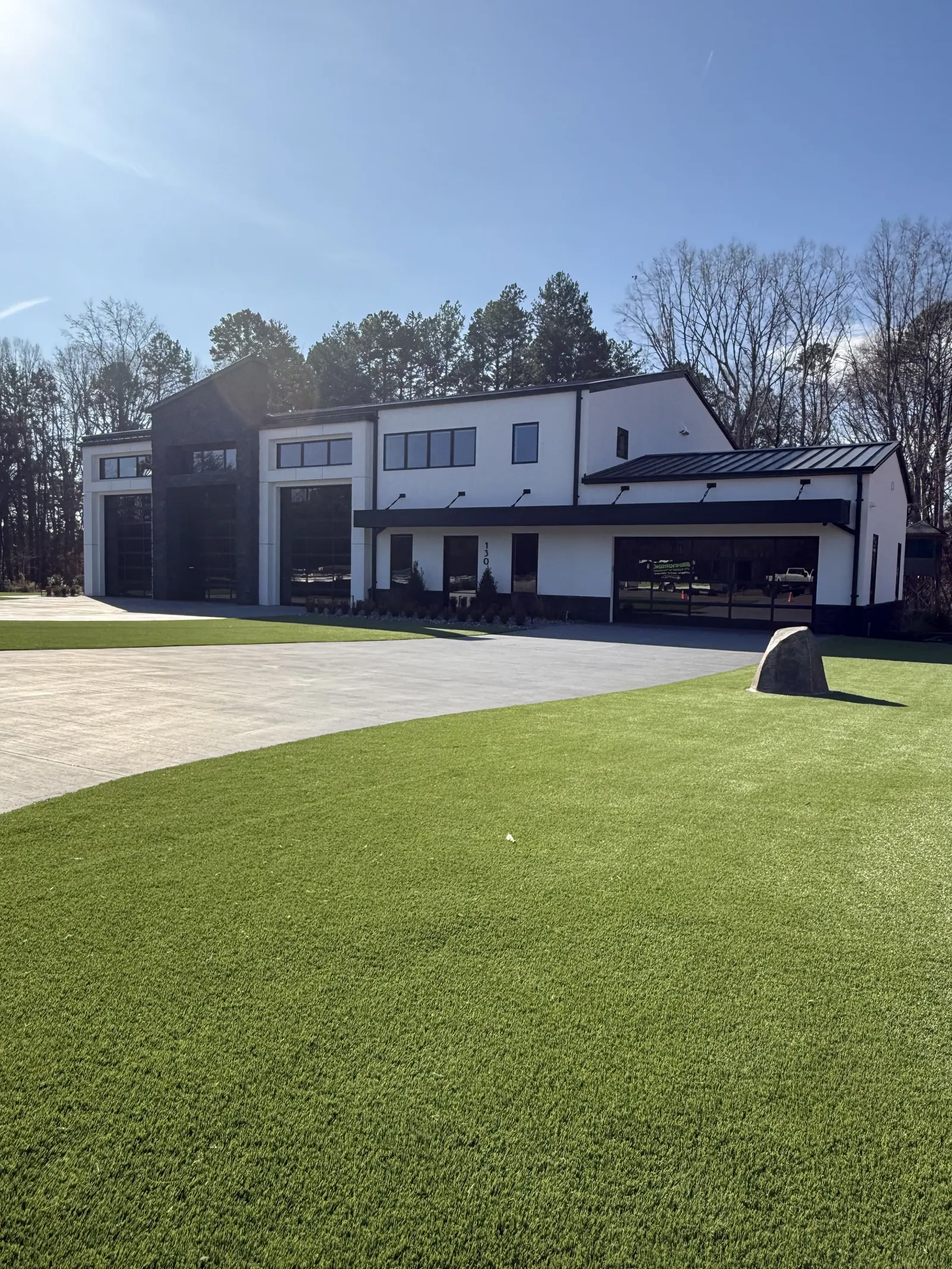 Synthetic lawn at a modern home installed by Dream Greens NC