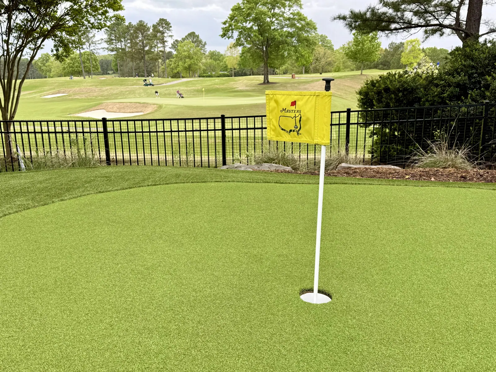 Backyard putting green overlooking a golf course in Charlotte