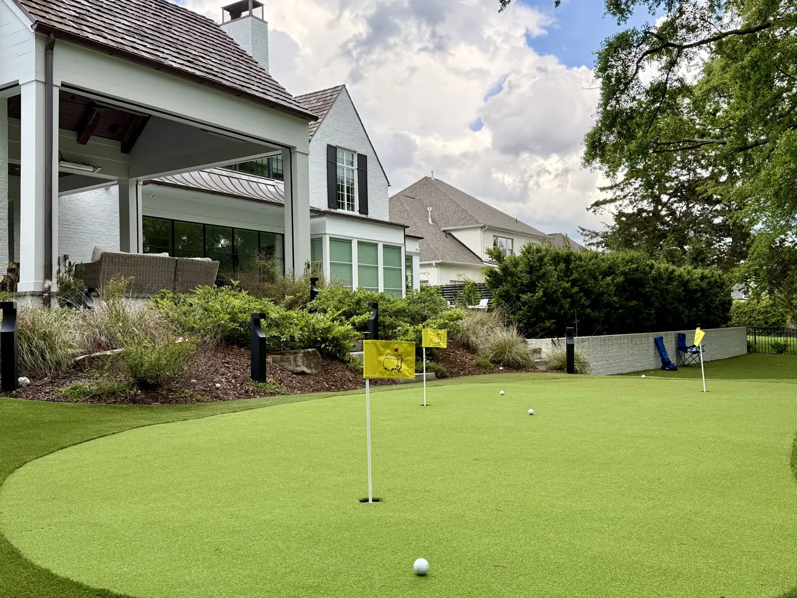 Backyard putting green overlooking a golf course in Charlotte