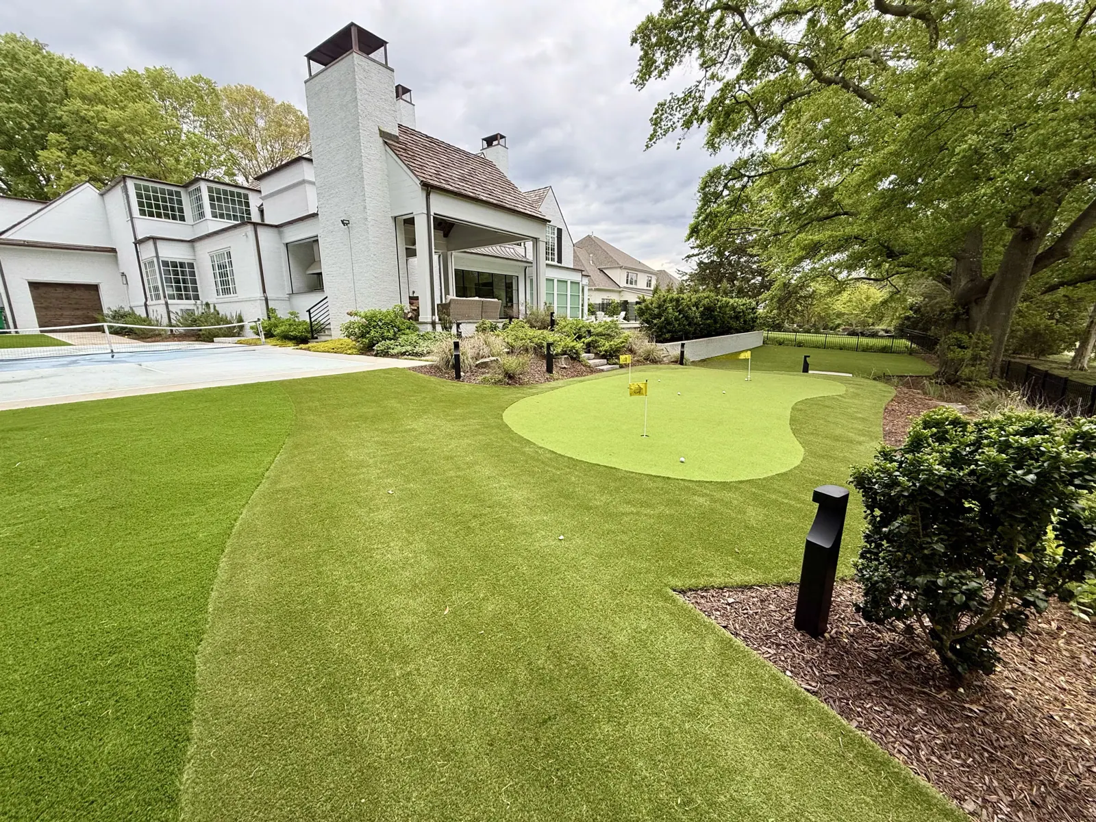 Backyard putting green overlooking a golf course in Charlotte